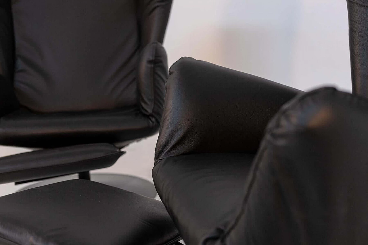 Pair of black leather armchairs with footrest cushion, 1970s 1405539