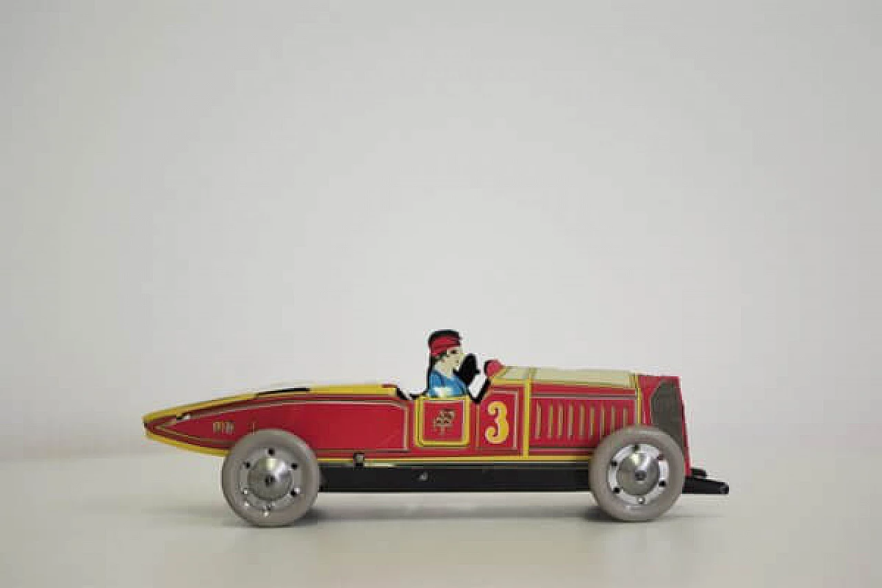 15 Tin car toy, 1990s 1406999