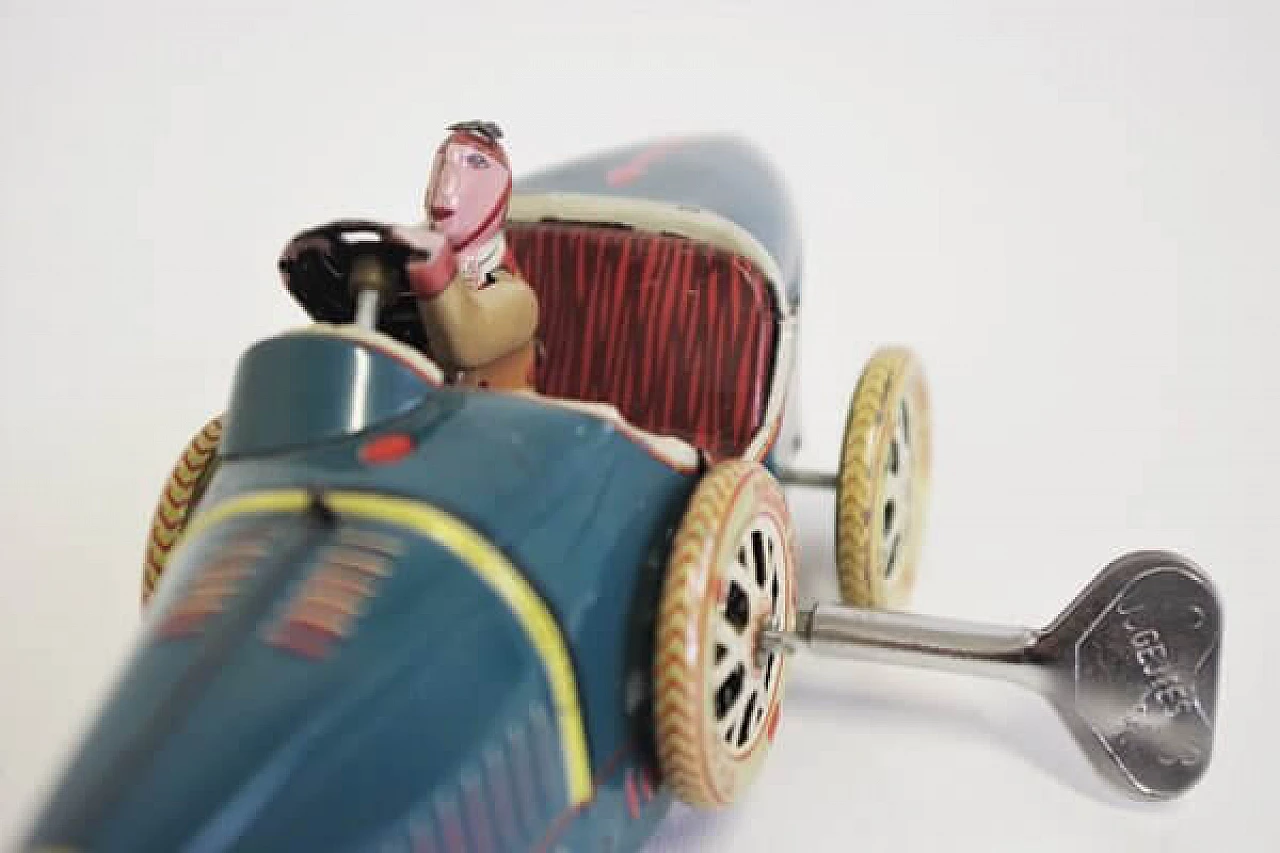 15 Tin car toy, 1990s 1407044