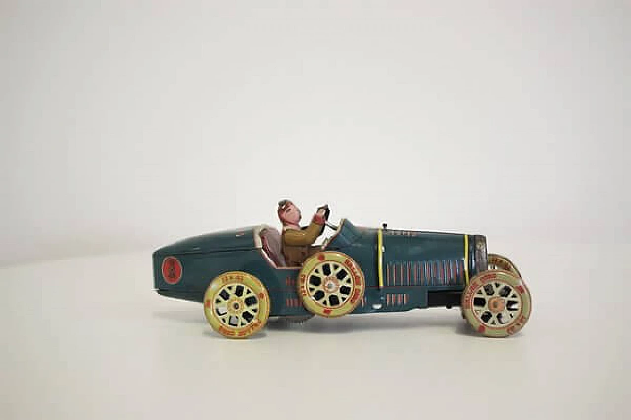 15 Tin car toy, 1990s 1407046