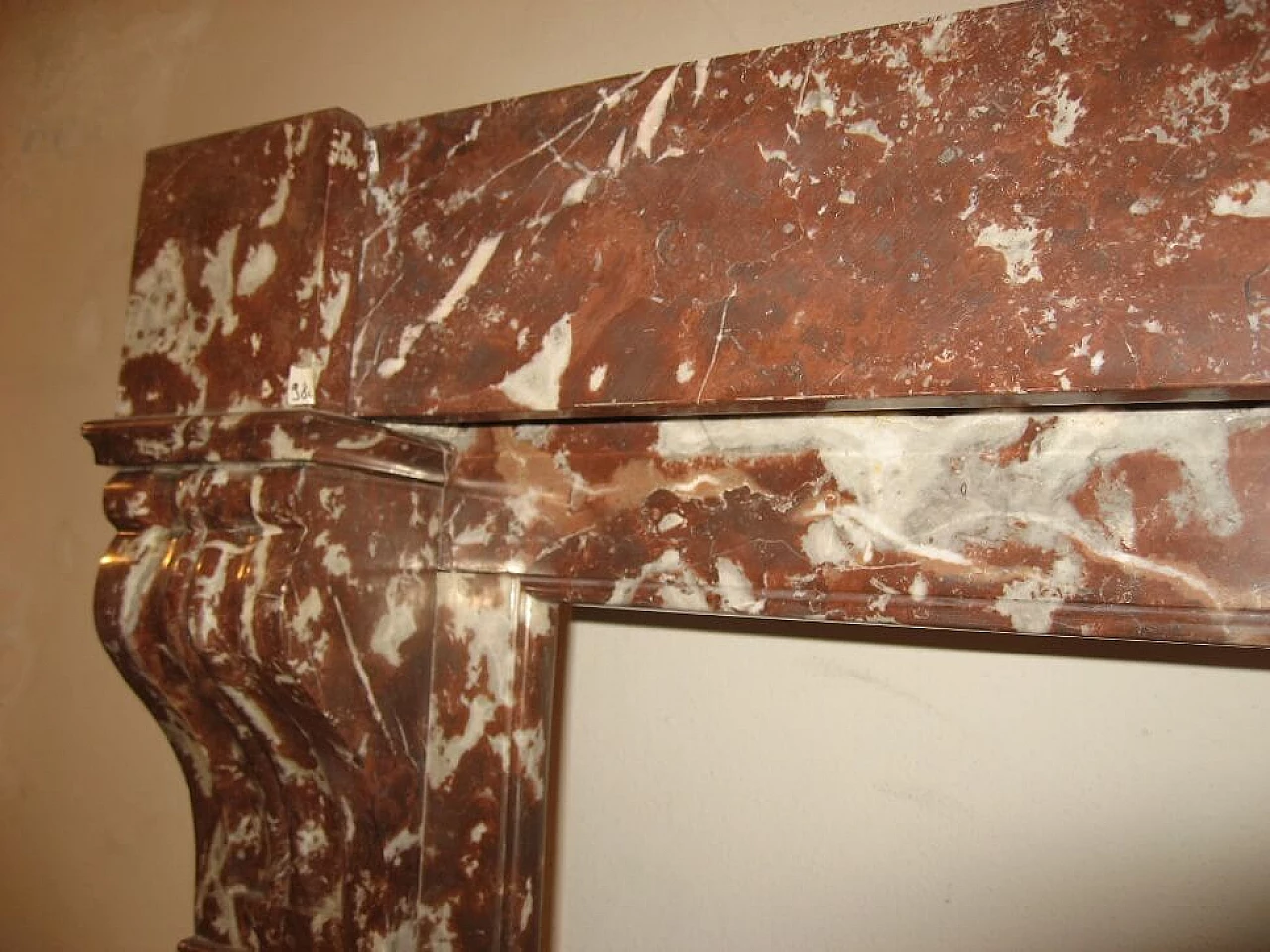 Palmettes model fireplace frame in red marble, 19th century 1461592