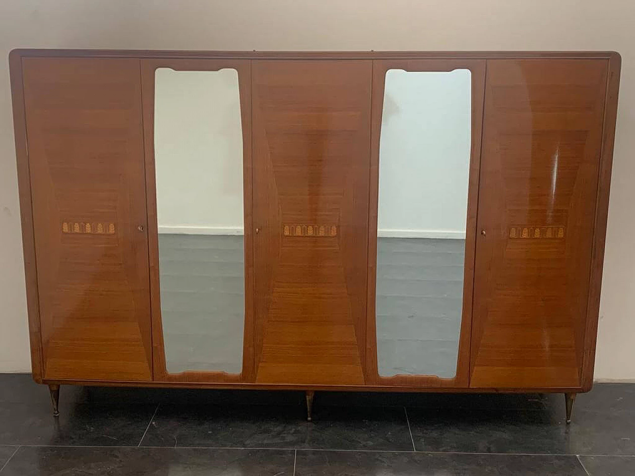 Closet with inlaid domed doors and brass finials, 1950s 1