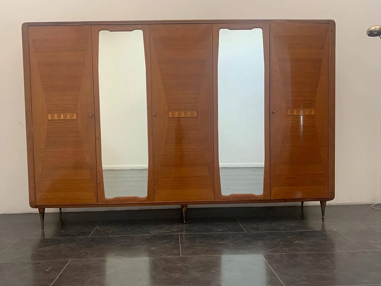 Closet with inlaid domed doors and brass finials, 1950s 2