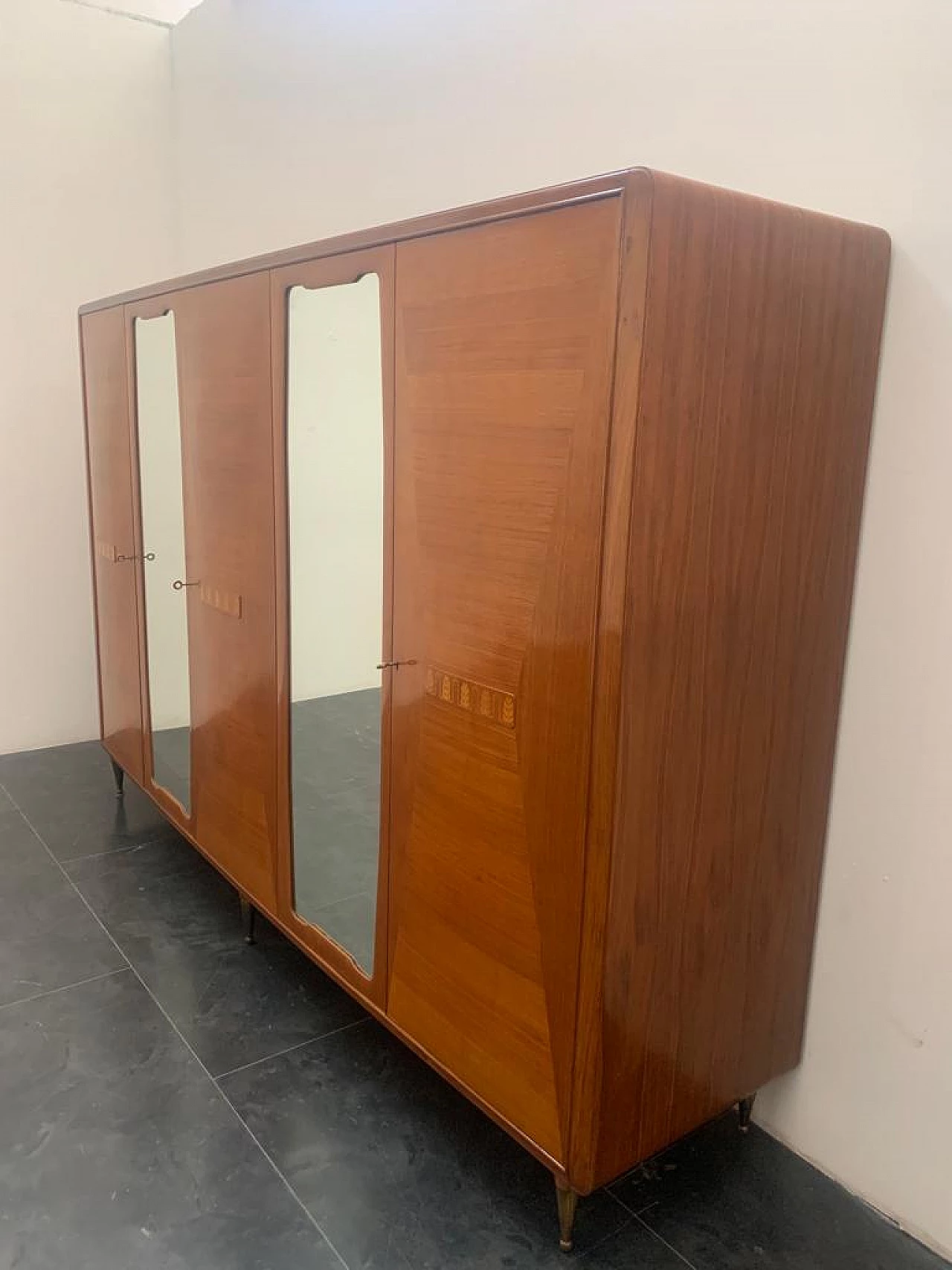 Closet with inlaid domed doors and brass finials, 1950s 3