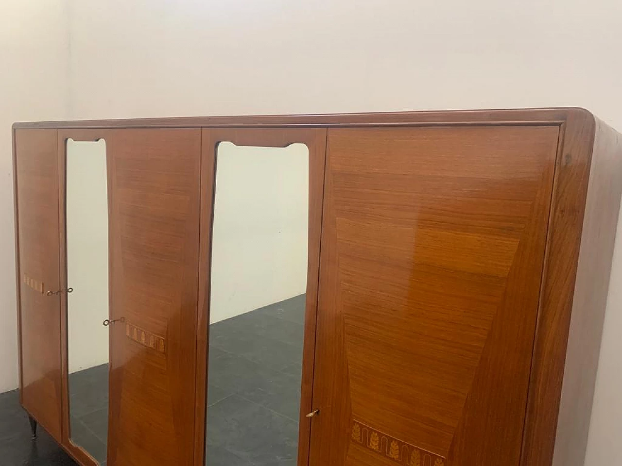 Closet with inlaid domed doors and brass finials, 1950s 4