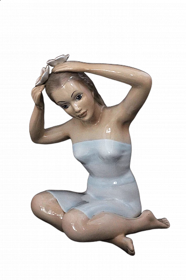 Statuette Girl sitting with her hands on her head by Ronzan, 1940s