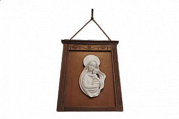 Madonna and Child in ceramic within carved wooden frame, 1950s
