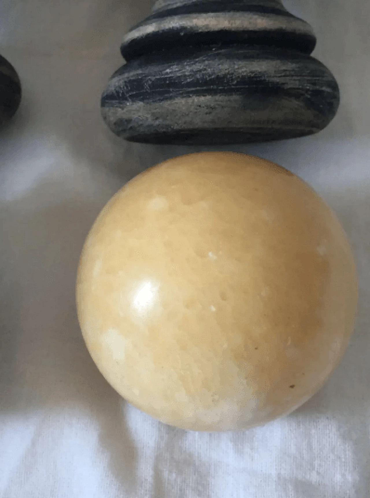 Pair of marble spheres on a black and beige wooden base, 1960s 10