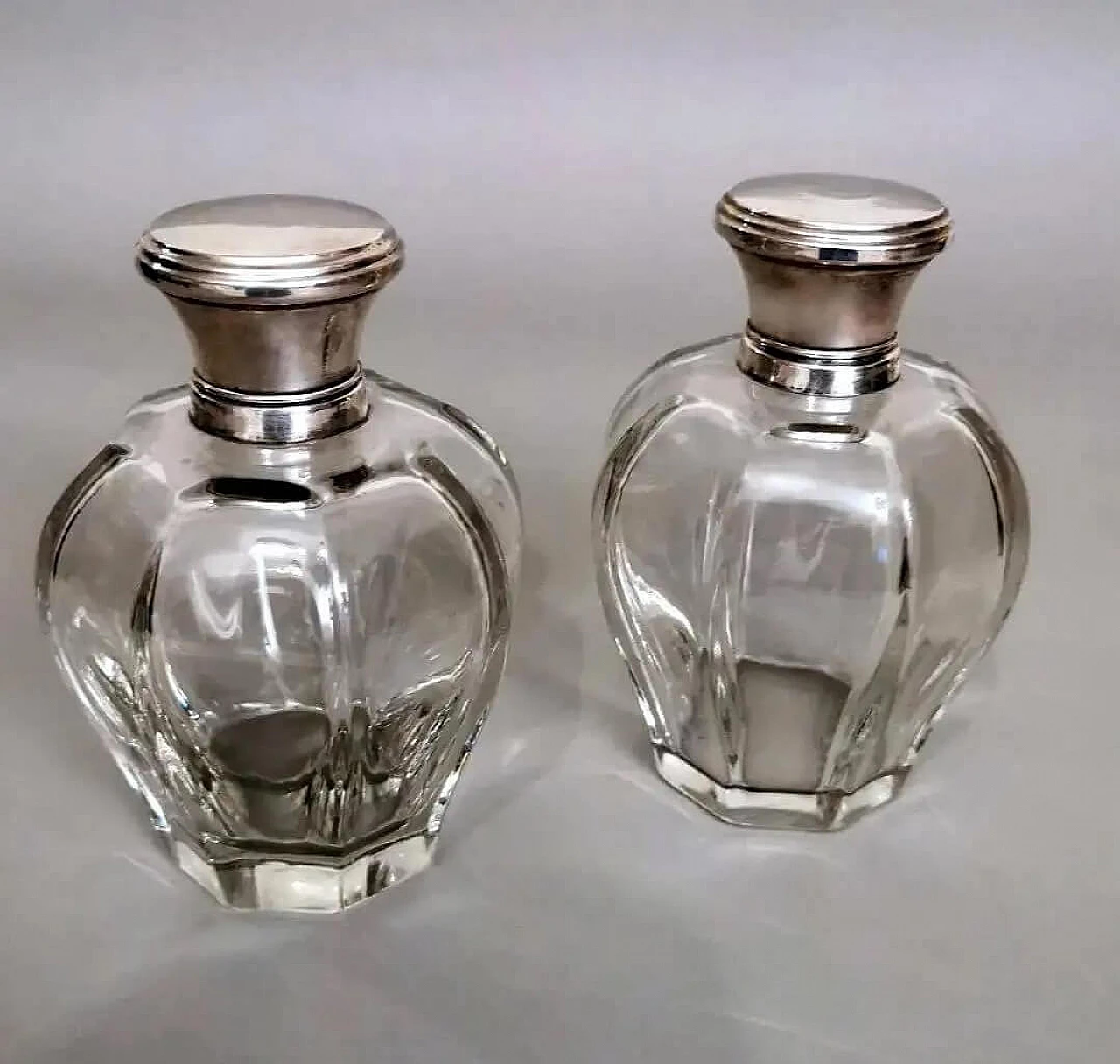Pair of Art Deco crystal toiletry bottles and silver lids, 1930s 1