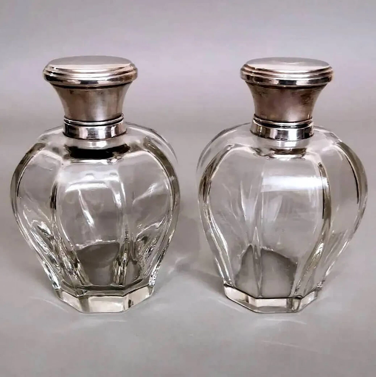 Pair of Art Deco crystal toiletry bottles and silver lids, 1930s 2