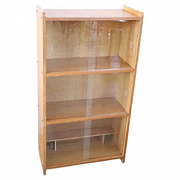 Small bookcase in wood with sliding doors, 1980s