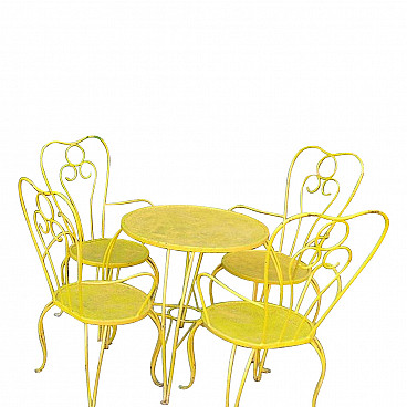 4 Chairs and a garden table in wrought iron, 1970s