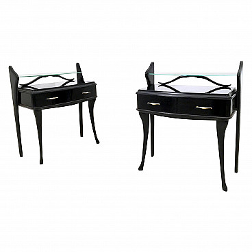 Pair of black lacquered wooden bedside tables with glass tops, 1950s