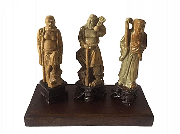 3 Sculture cinesi in pietra ollare su base lignea, anni '30
