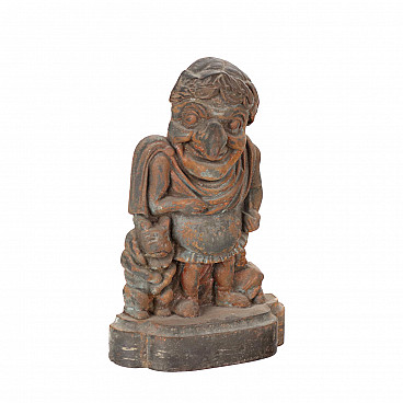 Cast iron doorstop in the shape of a dwarf with animal