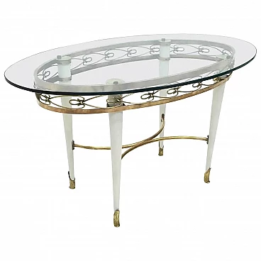 Brass coffee table with oval glass top in the style of Pierluigi Colli, 1950s