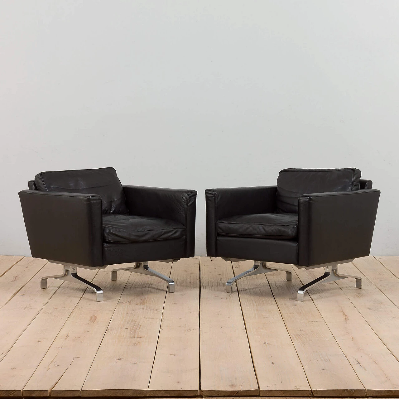 Pair of Scandinavian black leather lounge chairs in the style of Poul Kjaerholm, 1970s 1