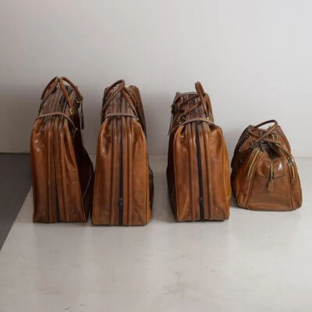 4 Leather travel bags, 1950s 1