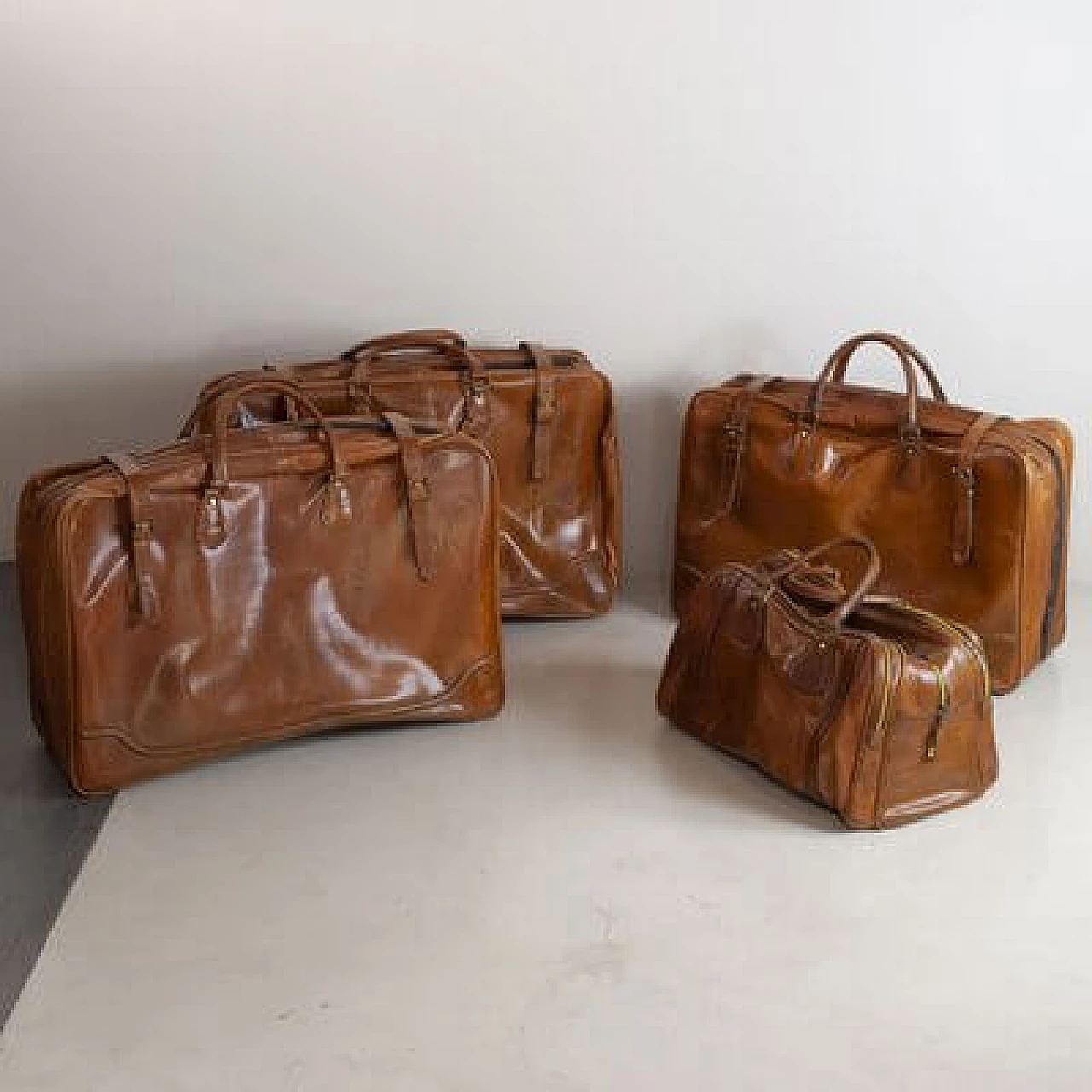 4 Leather travel bags, 1950s 6