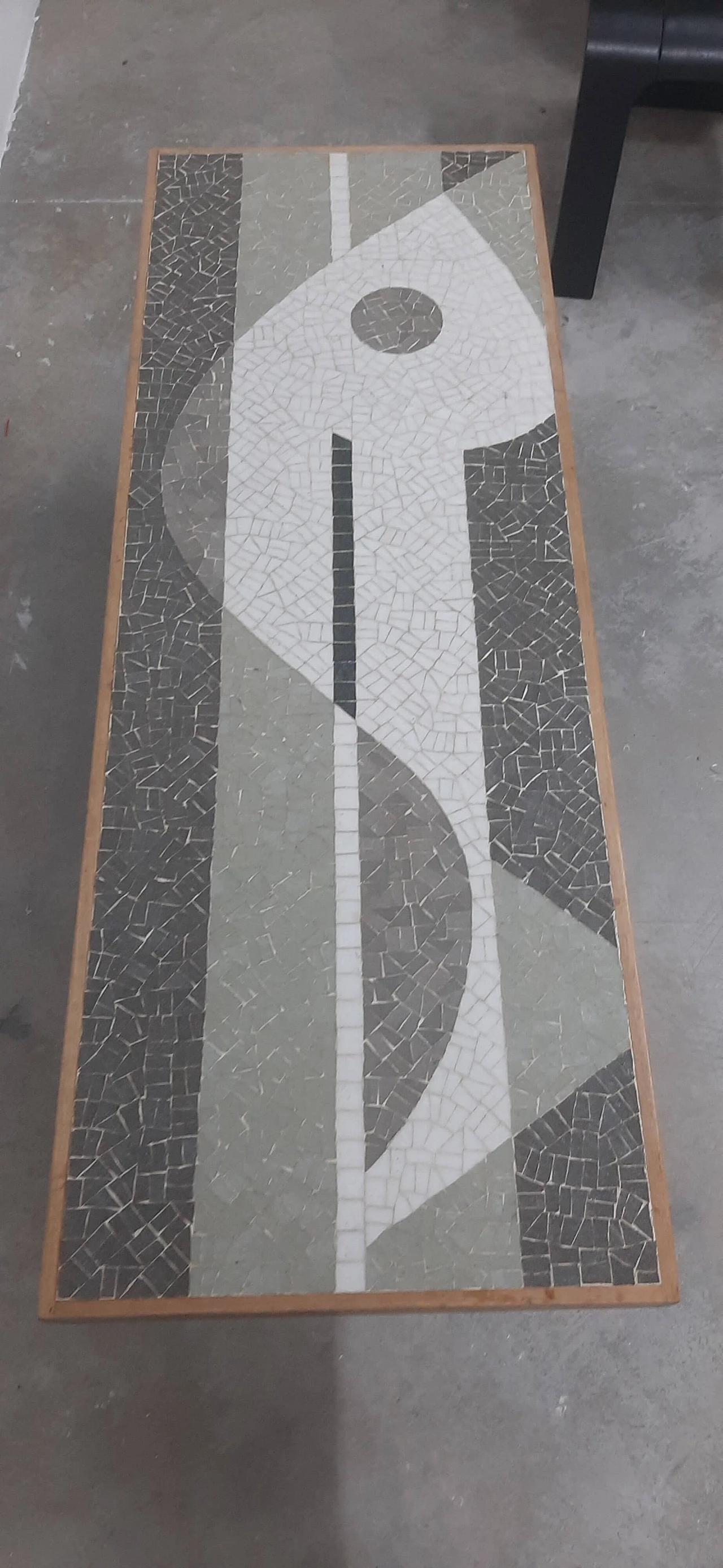 Coffee table with mosaic depicting a fish by Nendo 2