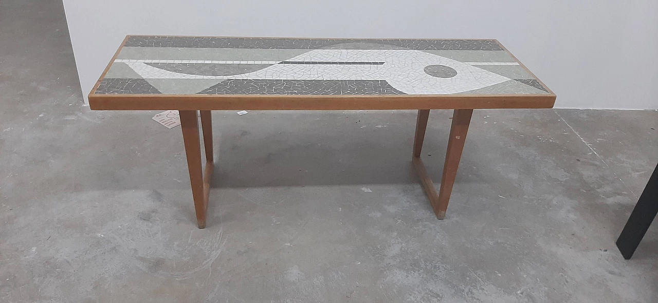 Coffee table with mosaic depicting a fish by Nendo 3