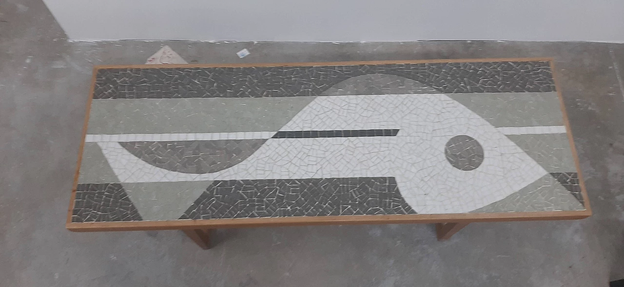 Coffee table with mosaic depicting a fish by Nendo 4