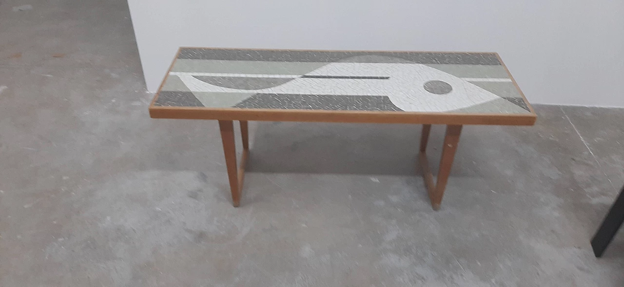 Coffee table with mosaic depicting a fish by Nendo 5