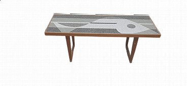 Coffee table with mosaic depicting a fish by Nendo