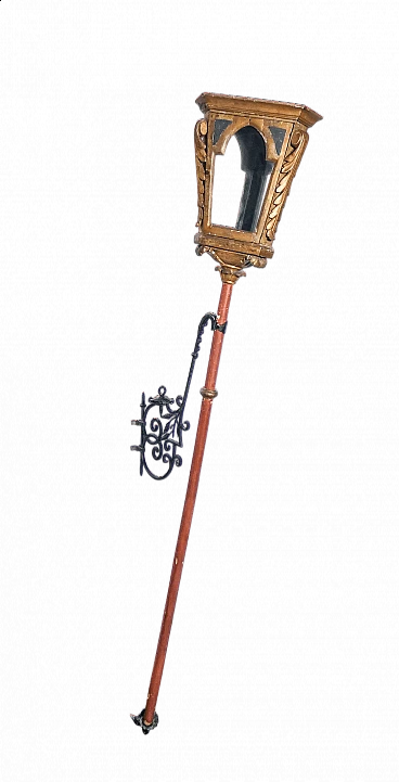 Carved, gilded and painted wooden pole lamp with wrought-iron wall fastening, 19th century