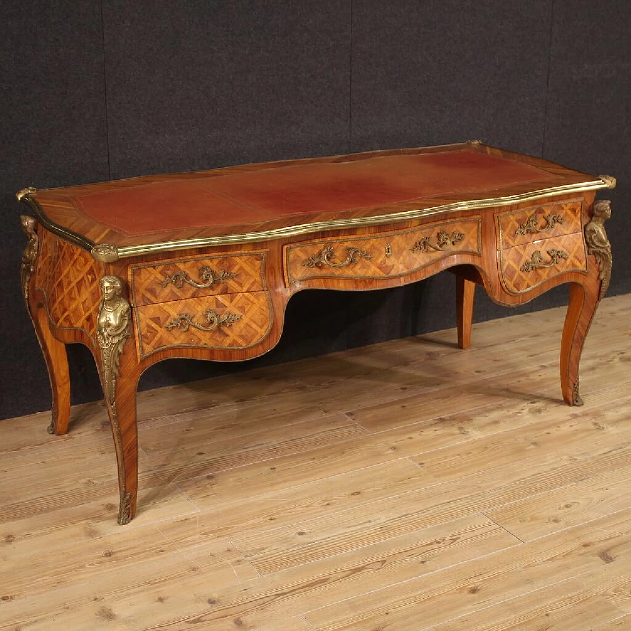 Carved wooden desk with bronze and brass decorations in Louis XV style 1