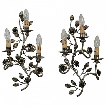 Pair of silver metal sconces with floral motif