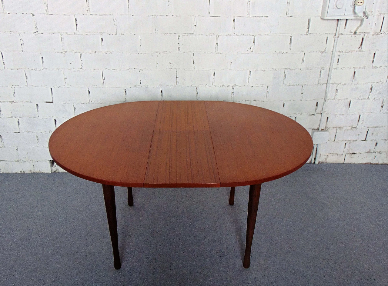 Extendable round teak table with skittle legs, 1960s 11