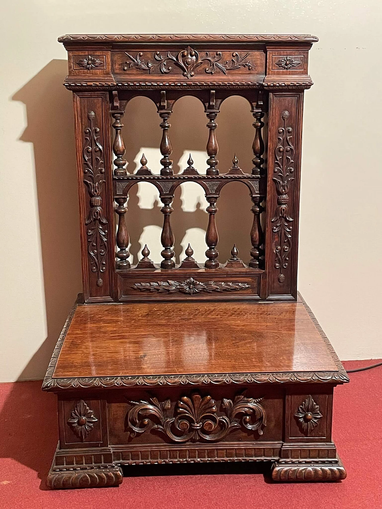 Walnut kneeling-stool with carvings, early 20th century 1