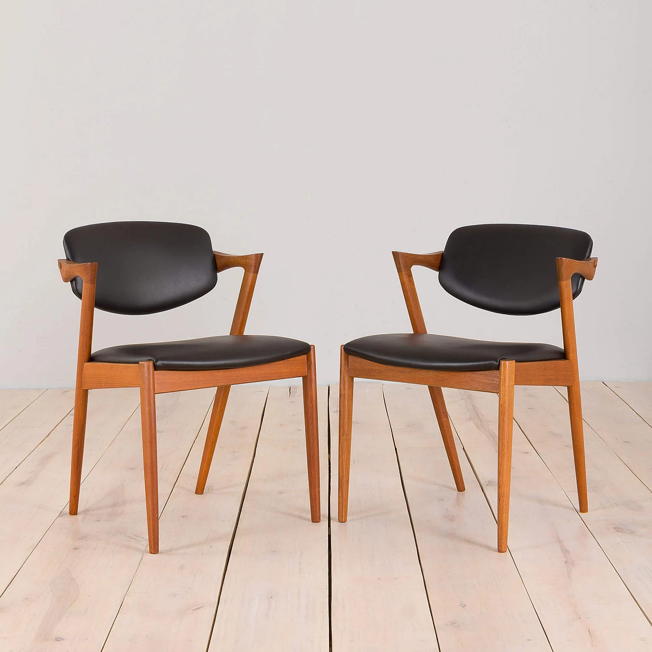 Pair of 42 teak and black leather chairs by Kai Kristiansen for Schou Andersen, 1960s 1