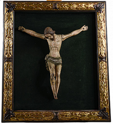 Carved painted wooden crucifix on frame, 17th century