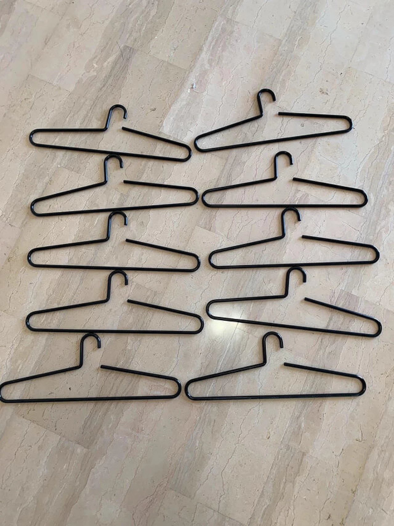 10 Black lacquered metal hangers, 1980s 1