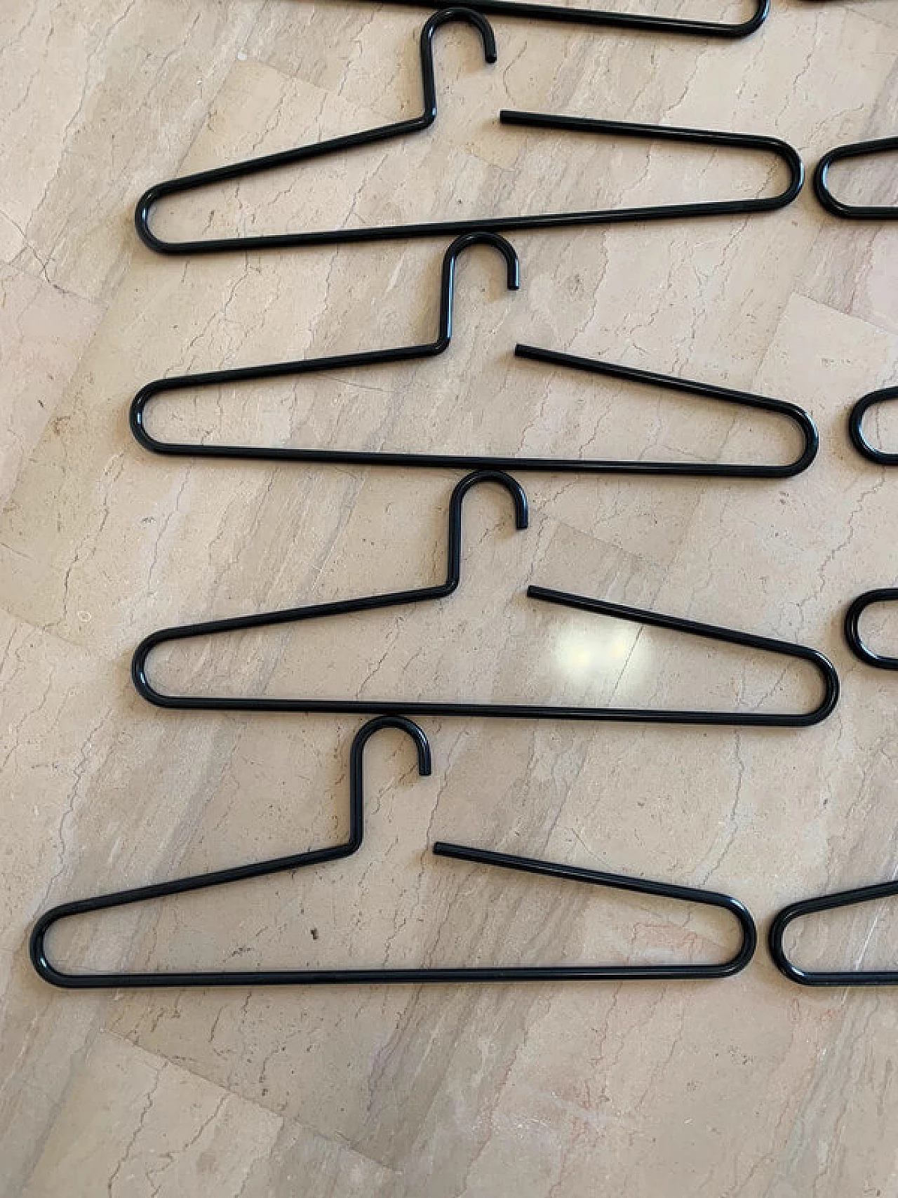 10 Black lacquered metal hangers, 1980s 6