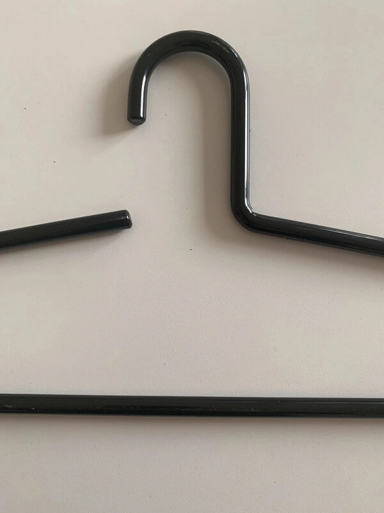 10 Black lacquered metal hangers, 1980s 11