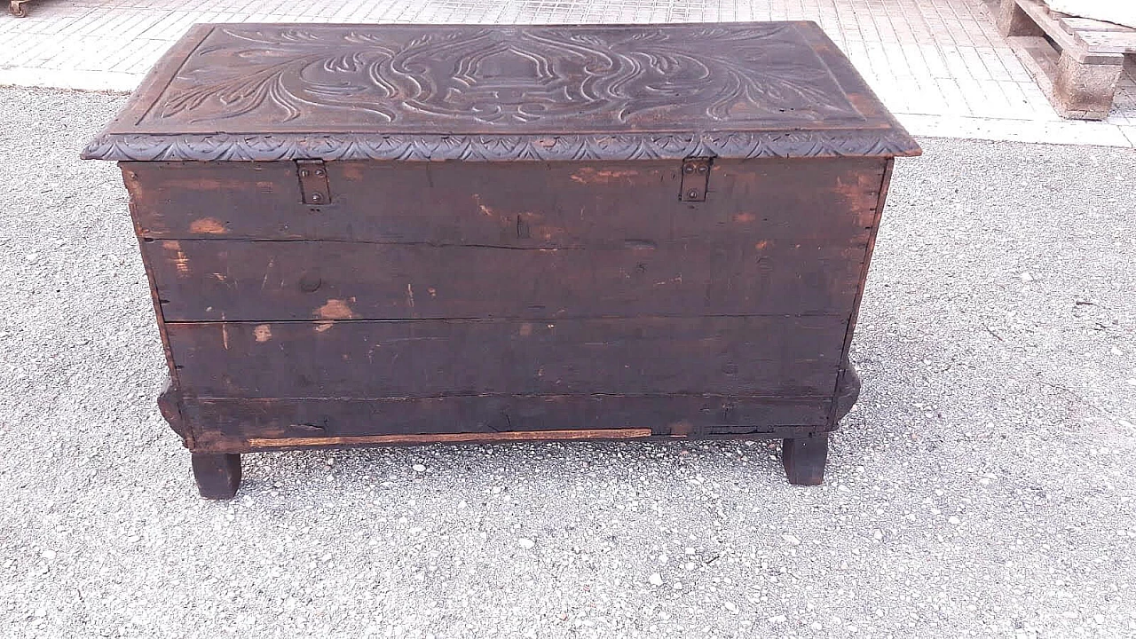 Wooden case carved with emblem and winged animals, late 19th century 2