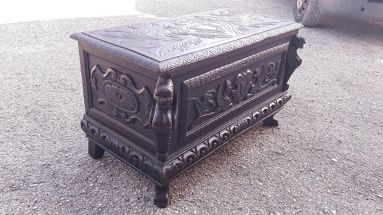 Wooden case carved with emblem and winged animals, late 19th century 4