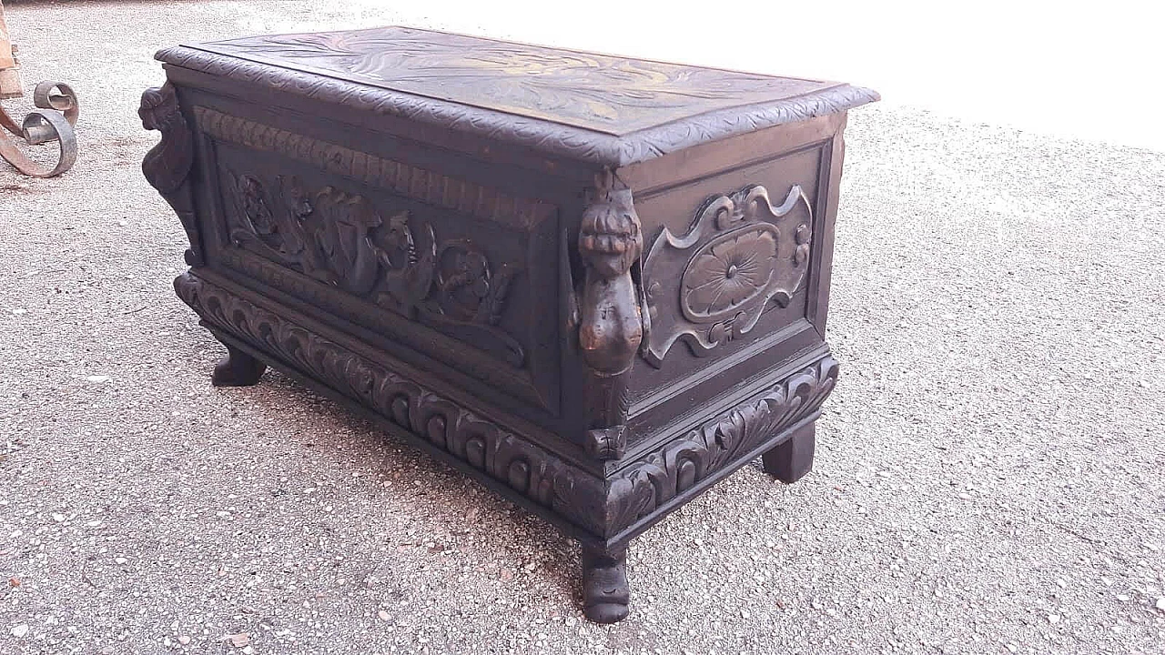 Wooden case carved with emblem and winged animals, late 19th century 5