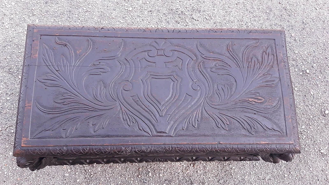 Wooden case carved with emblem and winged animals, late 19th century 6