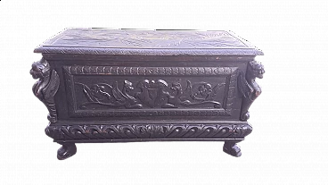 Wooden case carved with emblem and winged animals, late 19th century