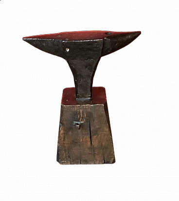 Tempered steel anvil with wood stand, 19th century