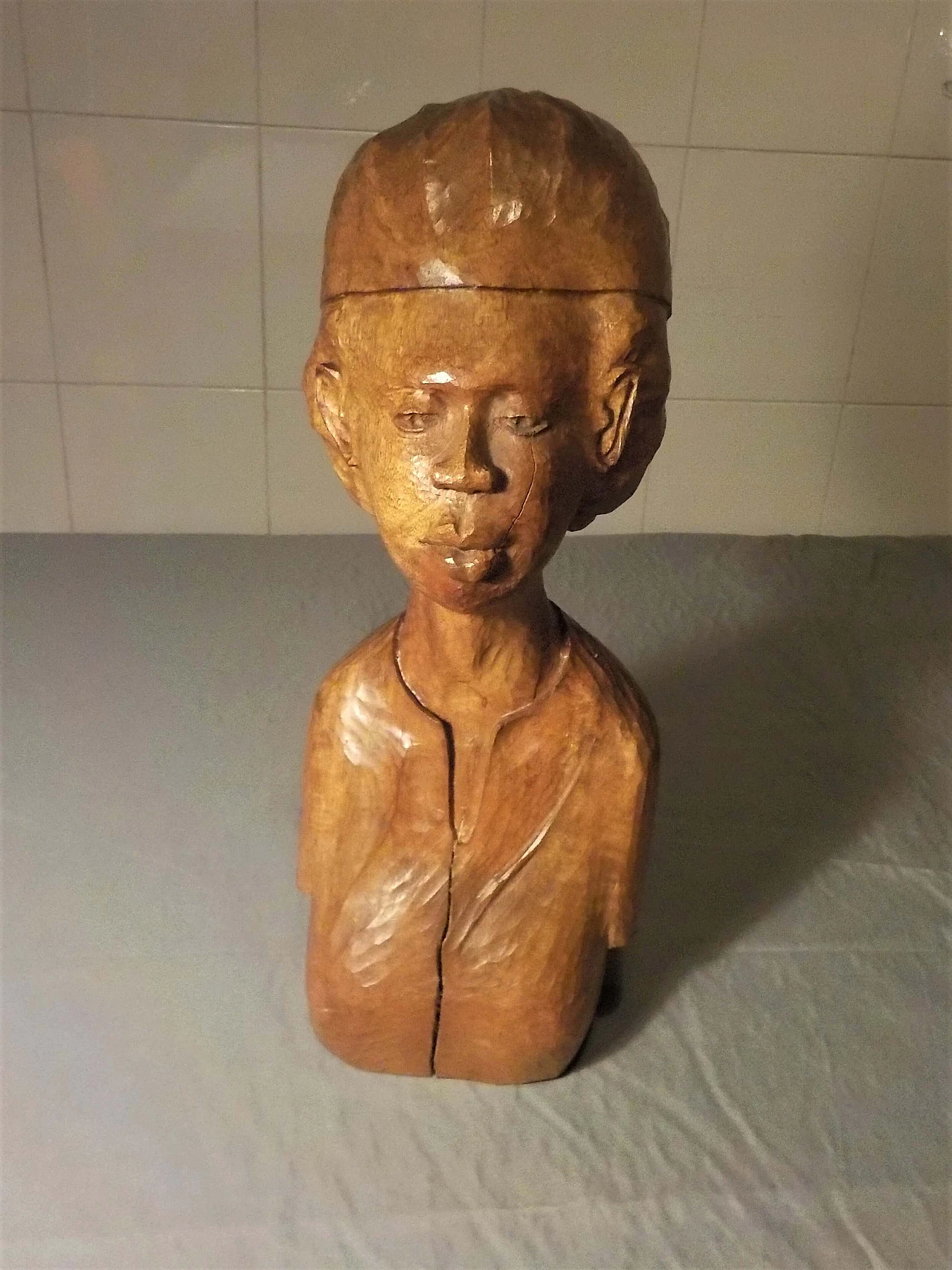 Hand-carved wooden bust sculpture of a woman, 1982 1