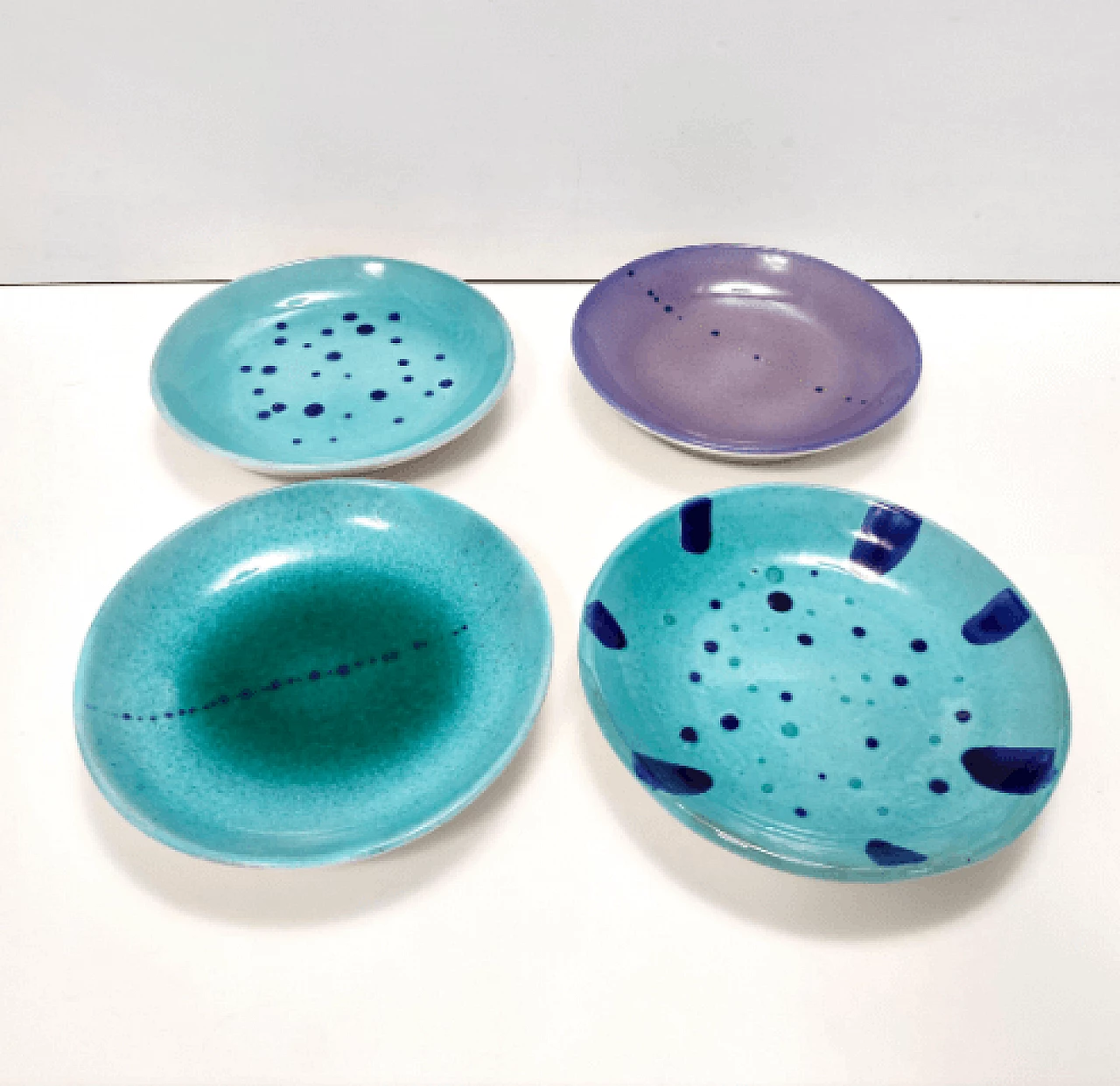 4 Plates in hand-painted and glazed Albisola terracotta, 1960s 5