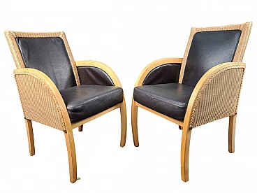 Pair of wood, rattan and leather armchairs by Lloyd Loom