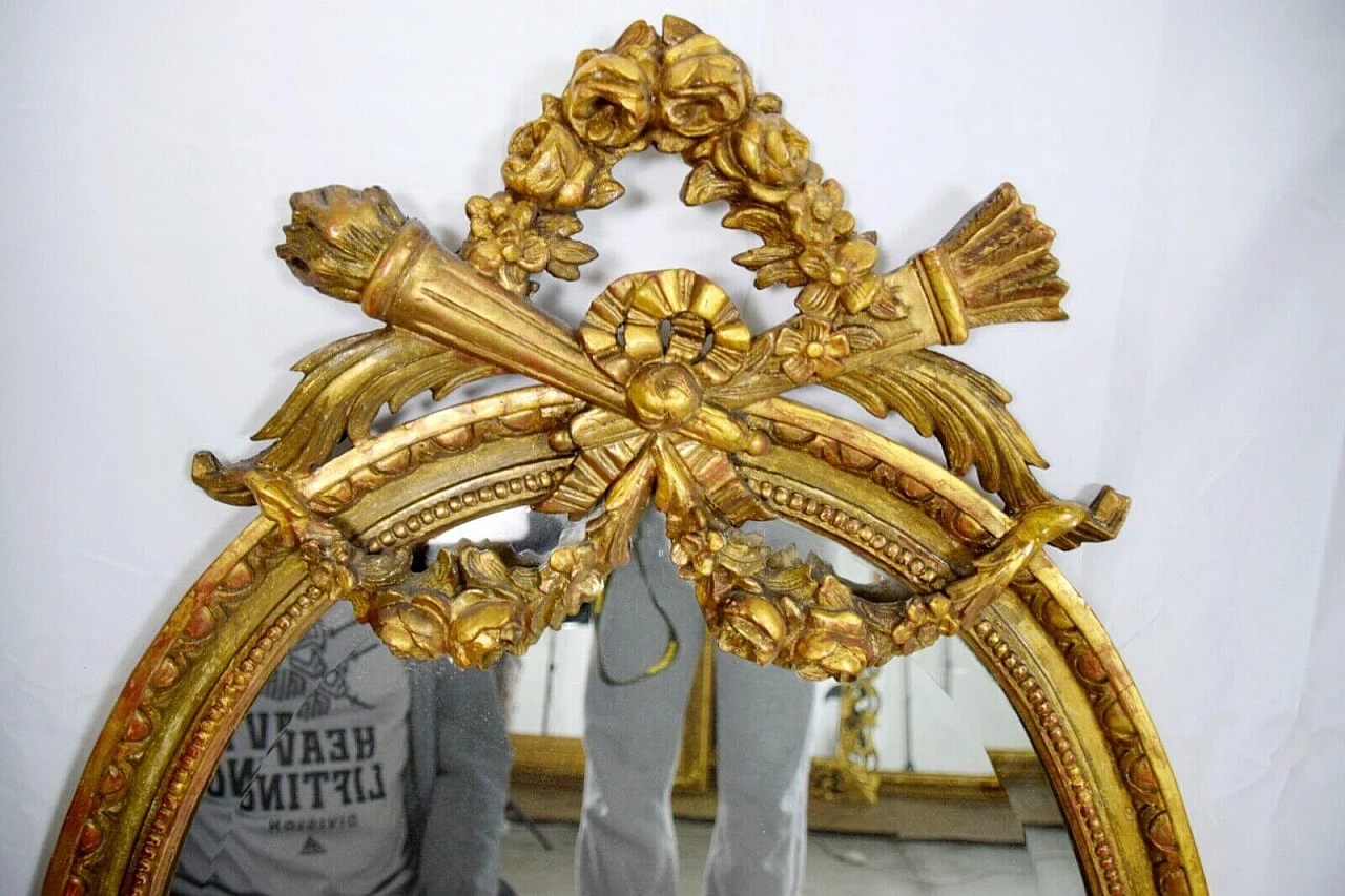 Louis XVI style oval carved and gilded wood mirror, 19th century 1