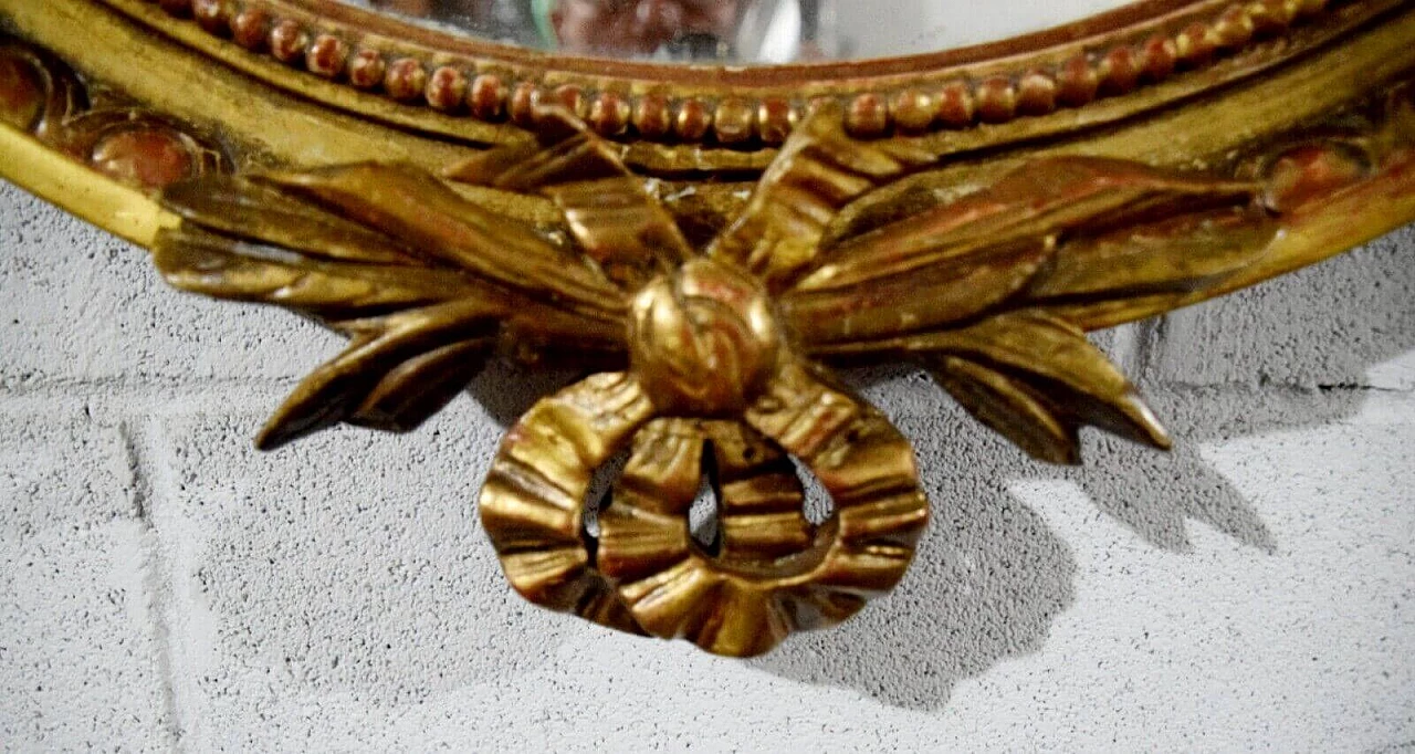 Louis XVI style oval carved and gilded wood mirror, 19th century 2