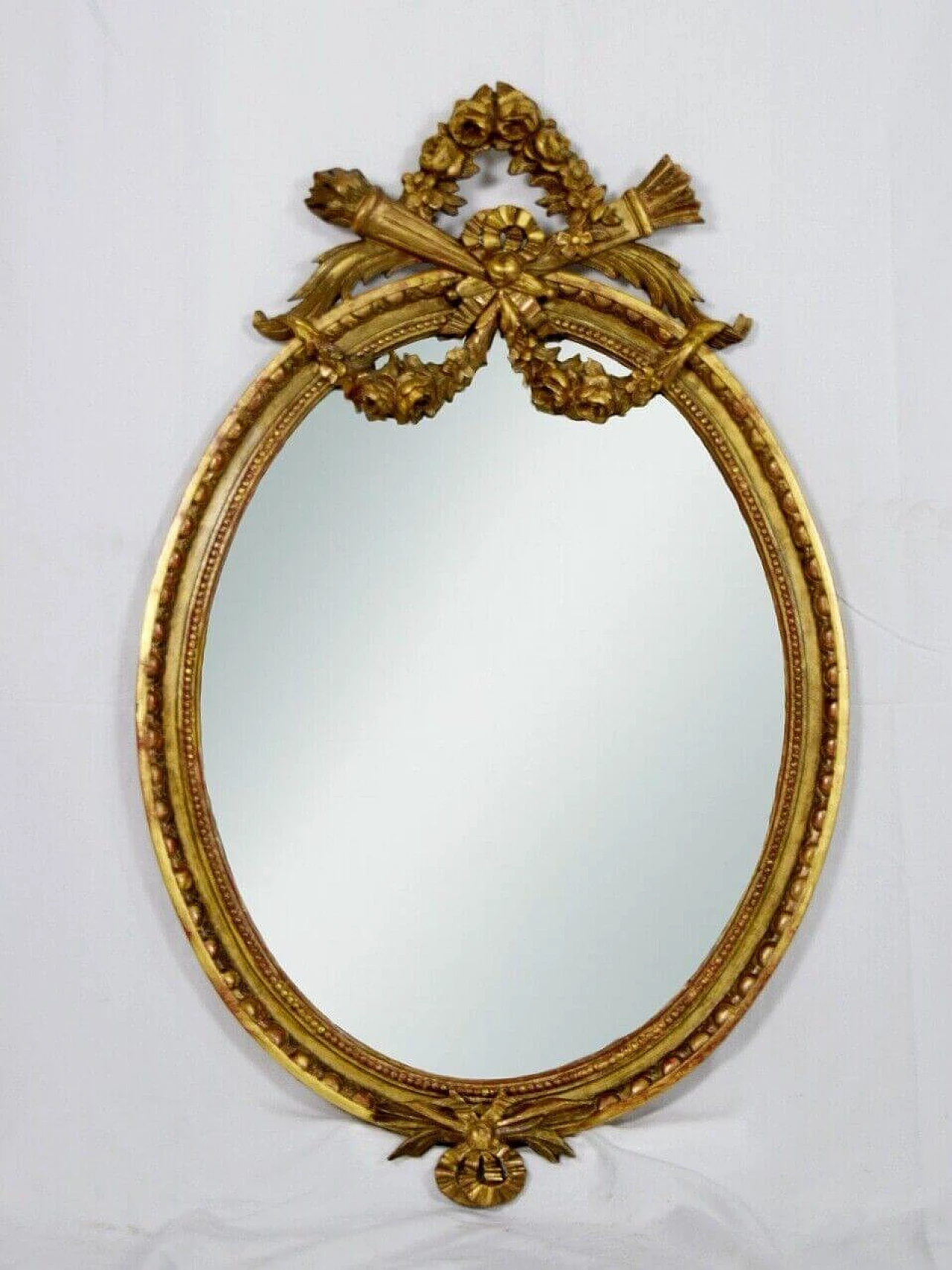 Louis XVI style oval carved and gilded wood mirror, 19th century 5